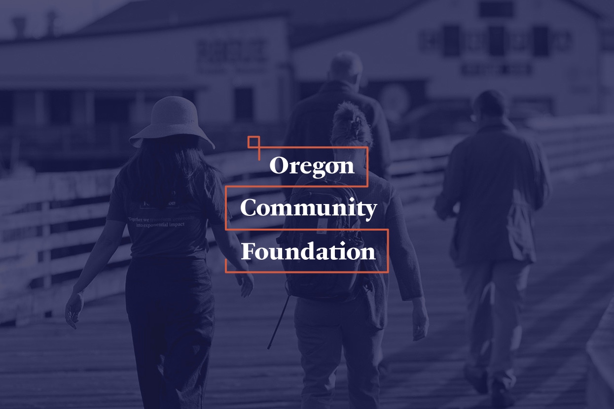 The Oregon Community Foundation logo overlaying a dark opacity version of their homepage hero image