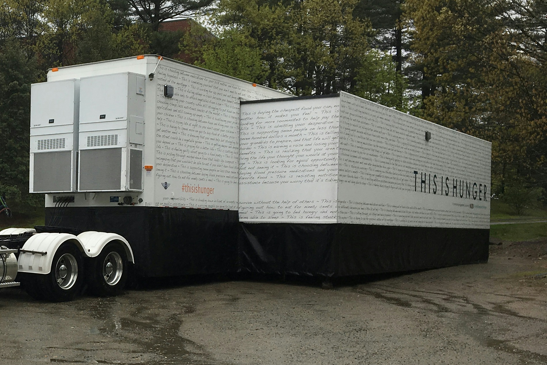 Image of expandable truck with word this is hunger on it's side.