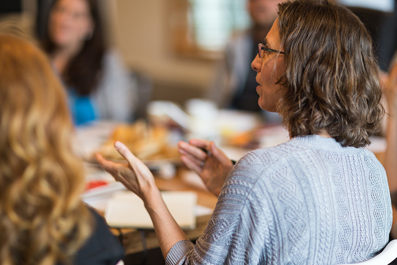 Talie Smith in discussion at meeting. 