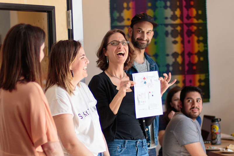 Images of people participating in a design tournament. 