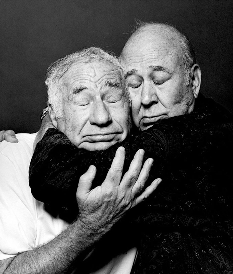 A picture of Mel Brooks and Carl Reiner lovingly embracing. 