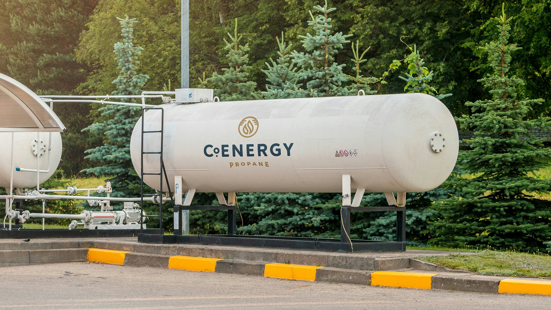 a photograph of a commercial propane tank with the CoEnergy logo painted on.