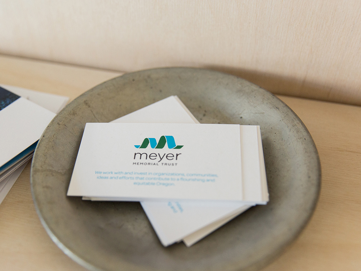 Photograph of Meyer Memorial Trust's business cards laying in a stone bowl.