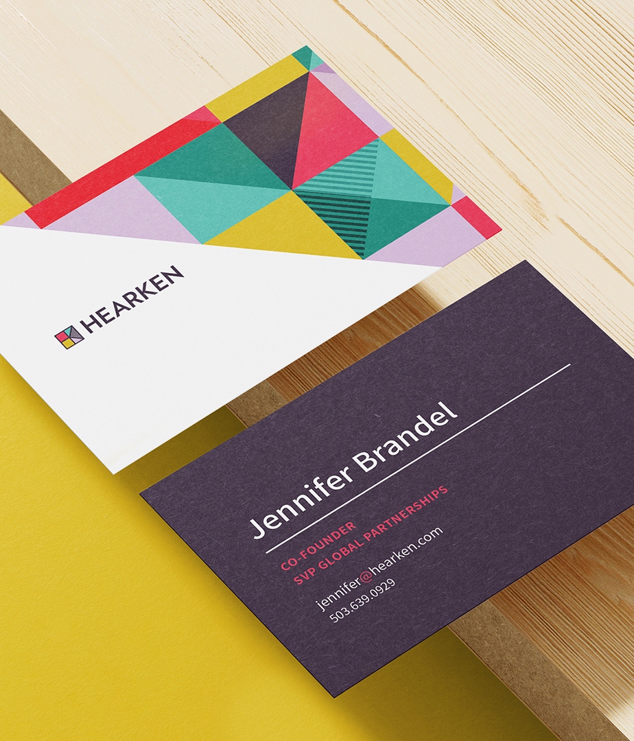 Hearken business cards feature their new brand pattern accentuating the top-right corner.