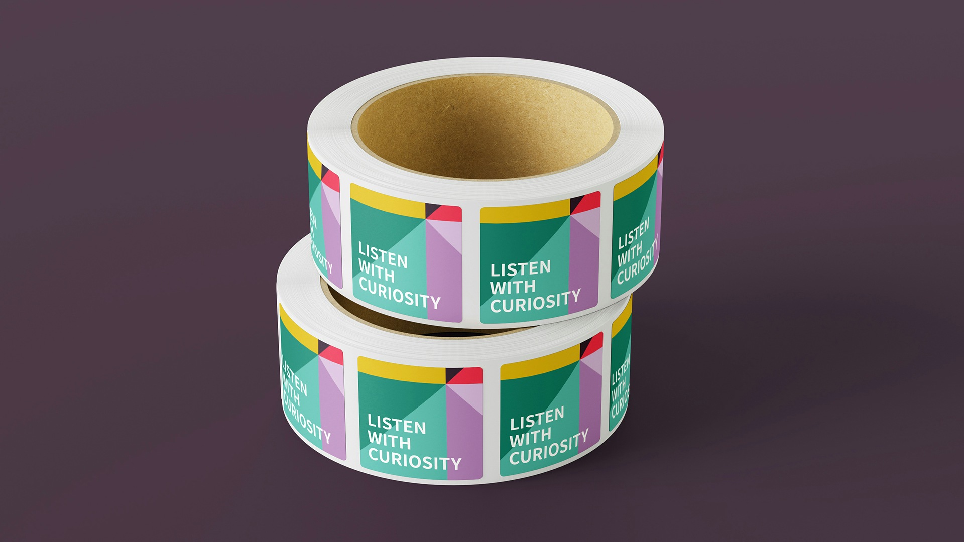 A roll of stickers with the new Hearken brand pattern.