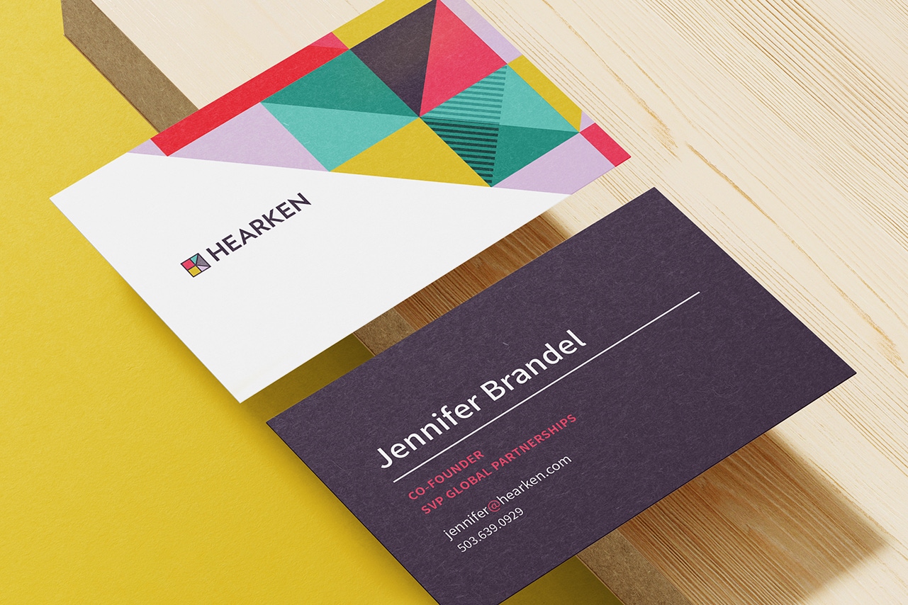 Hearken business cards feature their new brand pattern accentuating the top-right corner.