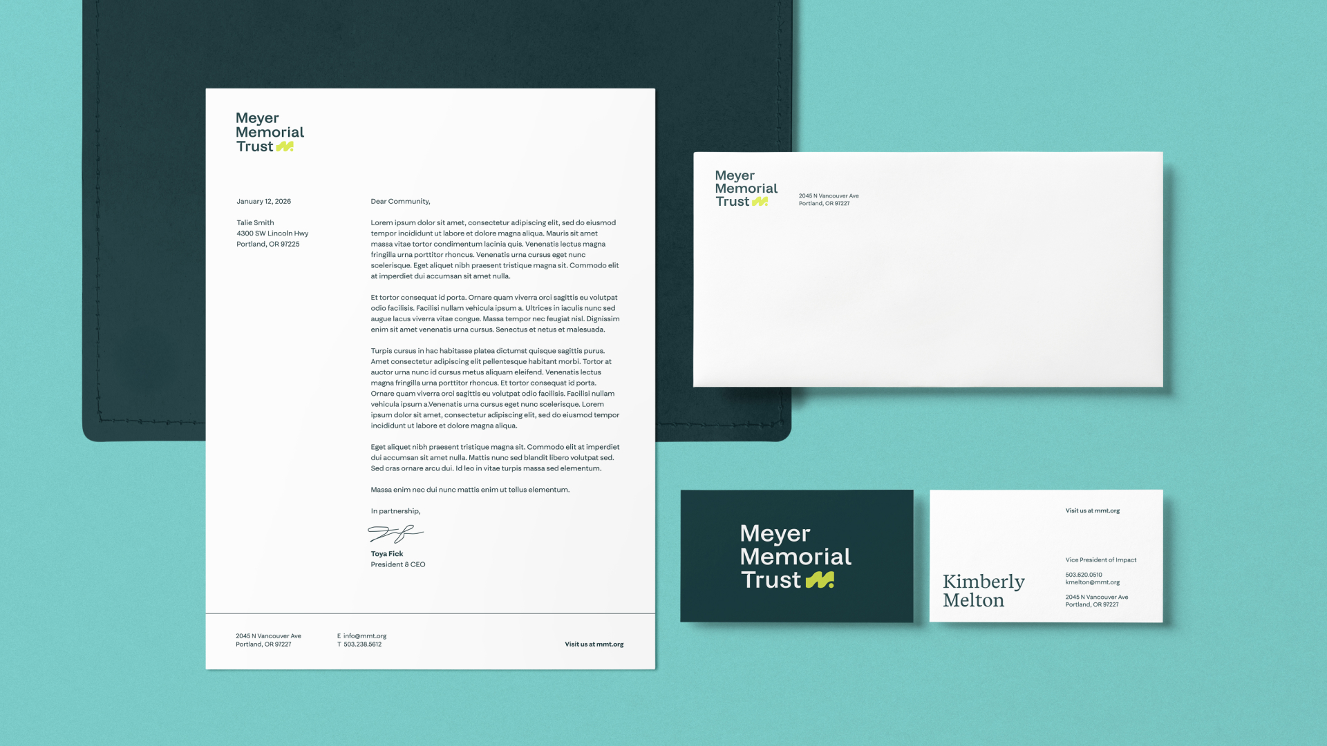 Meyer Memorial Trust stationery set with letterhead, envelope, and business cards on a teal background.