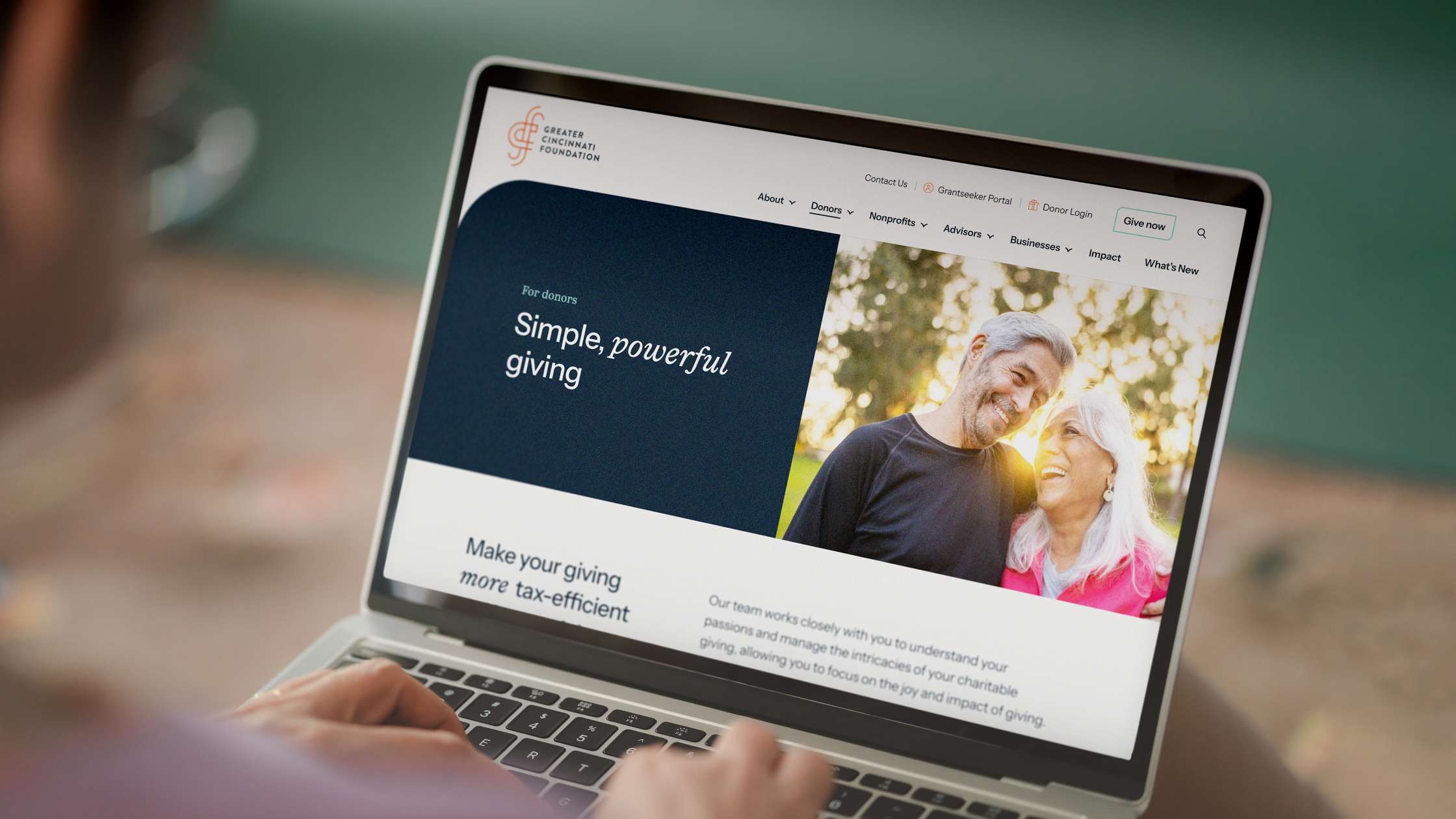 view of a person using a laptop to browse the Greater Cincinnati Foundation website