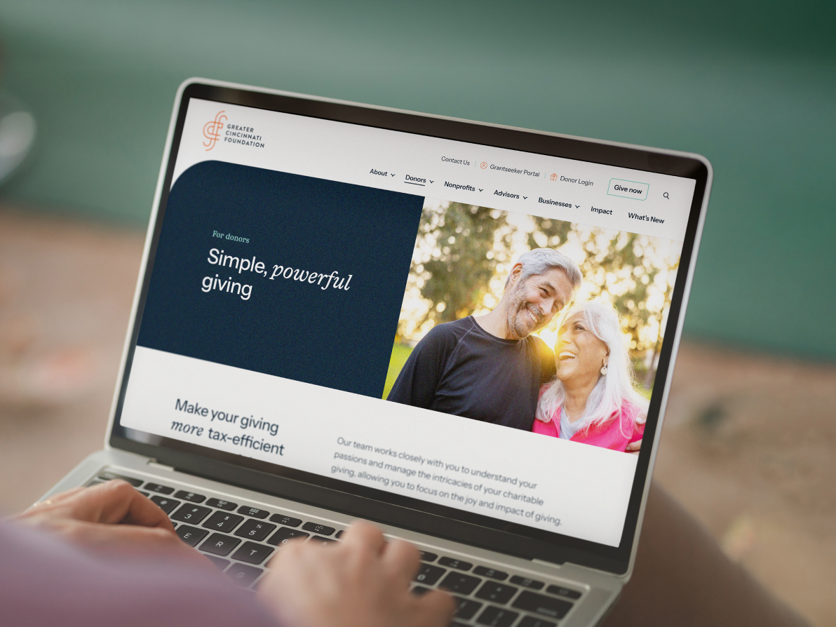 view of a person using a laptop to browse the Greater Cincinnati Foundation website
