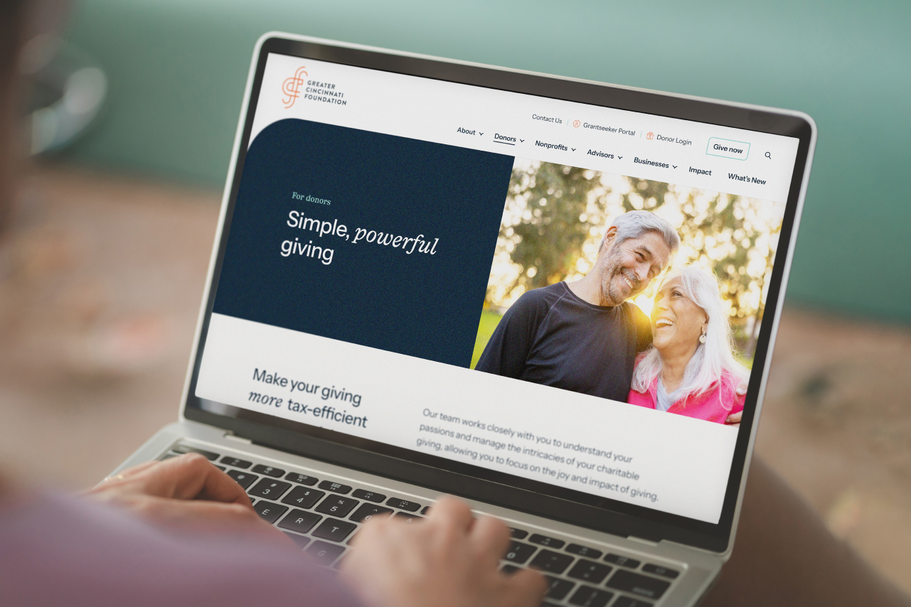 view of a person using a laptop to browse the Greater Cincinnati Foundation website