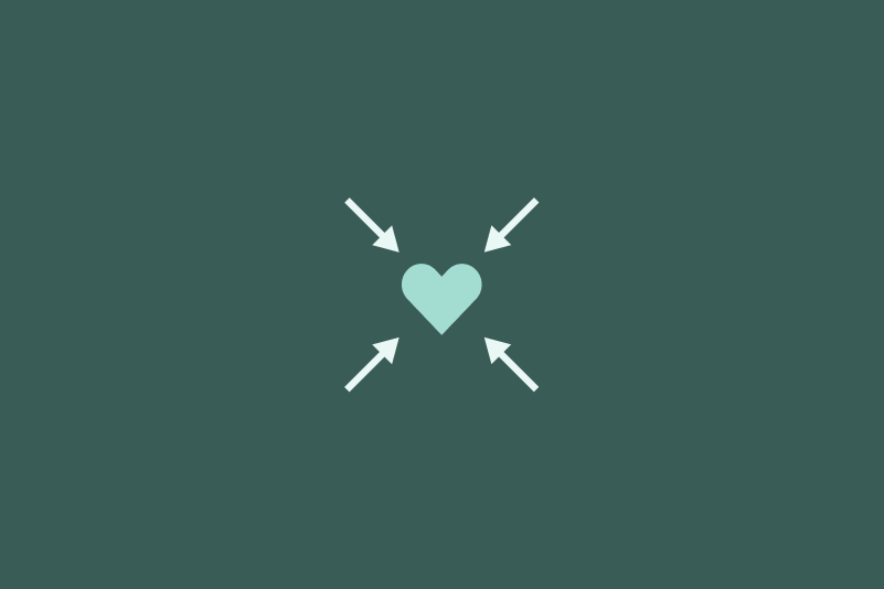 Small blue heart with 4 arrows pointing toward it on a green background